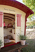 View into traditional gypsy caravan used as a playhouse Sussex UK