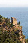Building on remote headland with view to sea on South West Italian coast