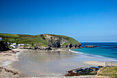 Coastal beach and headland at low tide Cornwall UK