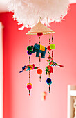 Colourful mobile with feathers in London home UK