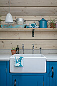 Belfast sink and panelling with shelf in Hampshire home England UK