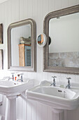 Vintage basins land mirrors in Surrey farmhouse UK