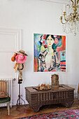 Modern canvas above Indian armoury chest in French chateau Lot et Garonne
