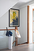 Framed poster with umbrella in stand in modern home London UK
