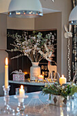 Dried flowers and lit candles in Berkshire kitchen UK