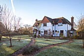 Footpaths in front garden of detached 1950s country house Surrey UK