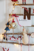 Tree decoration 'believe' with letter 'N' snowman and baubles with Surrey UK