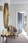 Shell chair with large vintage mirror in hallway extension of Victorian villa Tunbridge Wells Kent UK