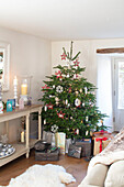 Presents under Christmas tree in Surrey cottage UK