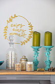 'Enjoy every moment' wall deco with candles in Sussex home UK