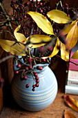Autumn leaves and berry arrangement in Isle of Wight home UK