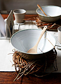 Bowls and spoons on rustic placemats in Isle of Wight home UK