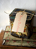 Christmas label on vintage storage tin in Isle of Wight home UK