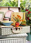 Artwork canvas with plates and bowls in vintage suitcase Isle of Wight, UK