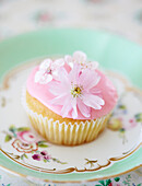 Pink fairycake decorated with flowers
