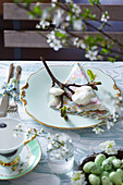 Easter Table setting with magnolia buds and blossom