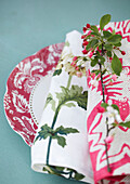 Floral plate detail with napkin and blossom