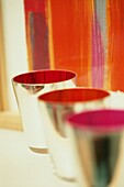 Colourful metal beakers