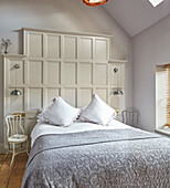 Bedroom with decorative white wall panelling