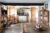 Large kitchen with rustic dining table in a country house