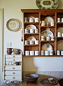 Crockery on antique wall-mounted shelves