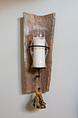 Candle sconce made from old roof tile