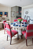 Round table with upholstered chairs