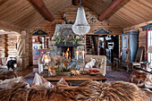 Rustic living room with fireplace and crystal chandelier