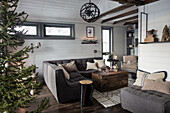 Corner sofa in rustic living room with Christmas decorations