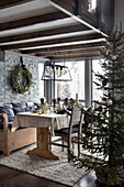 Rustic dining area with wooden furniture and Christmas decorations