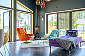 Living room with wood-burning stove and panoramic windows