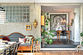 Living area with bench, plants and glass block wall