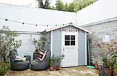 Garden shed, beanbags and fairy lights on terrace