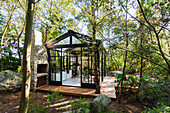 View of glass house in the forest