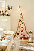 DIY Christmas tree made from branches, Christmas baubles, fairy lights and a star