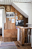 Rustic interior with wood panelling and photo wall