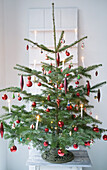 Christmas tree with candles and glass ornaments