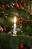 Christmas tree with candles and glass ornaments (detail)