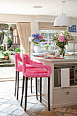 Kitchen island and pink bar stools