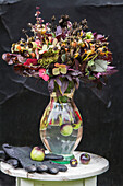 Autumn bouquet of garden flowers in vase