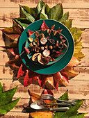 Place setting with colorful autumn leaves