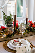 Christmas table with pine cones and candles