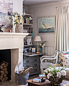 Writing desk and chair with cut flowers in a cottage