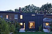 From garden to new zinc clad volume at dusk