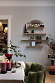 Wall mounted shelf with Christmas decoration in dining room