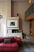 Red leather sofa and custom-made living room cabinet, gallery above in a room