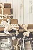 Christmas presents wrapped in wrapping paper with lace ribbon