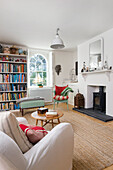 White painted living room with fireplace and bookshelf
