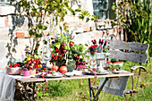 Set summer table decorated with fruits, berries, and vegetables