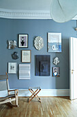 Seating in front of blue wall with pictures